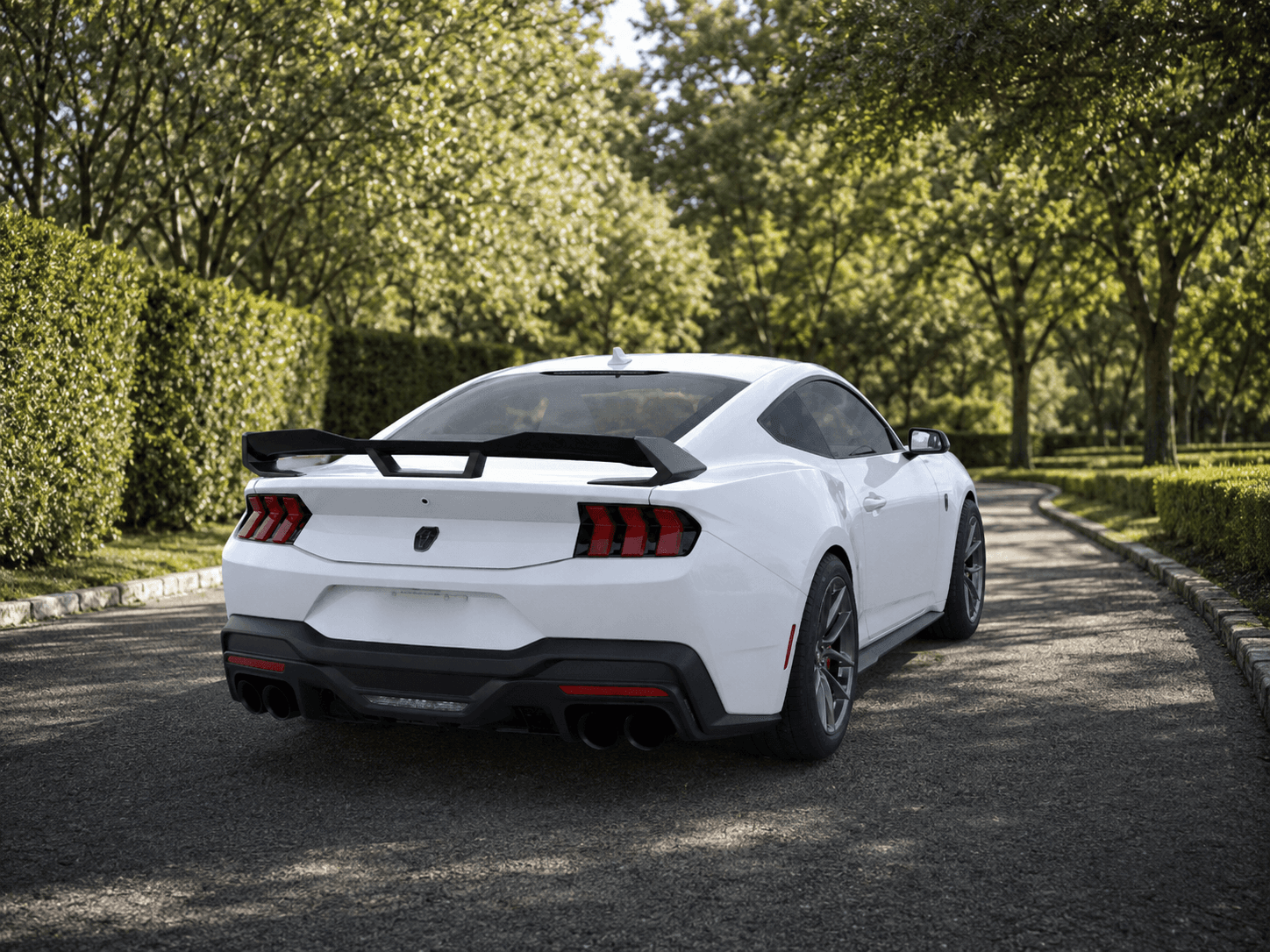 Rear view of the 2026 Ford Mustang Dark Horse on estate grounds